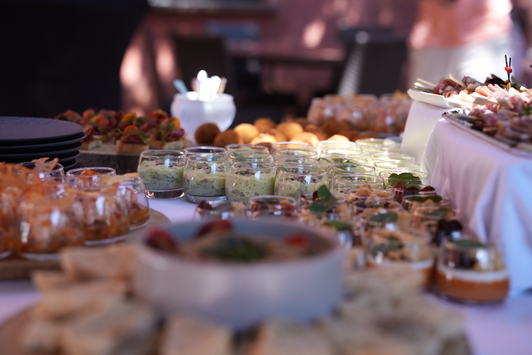 Event reception table with prepared food and glassware